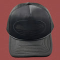 Cortiez All-Black Monochromatic Oval Ship Logo Trucker Hat